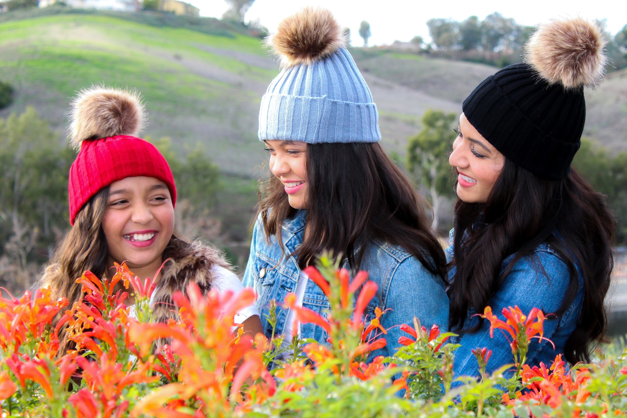 Lifestyle blogger Debbie Savage of To Thine Own Style Be True sharing her love for ILYMIX Fashion Accessories with her two daughters wearing Faux Fur Pom Pom Beanie