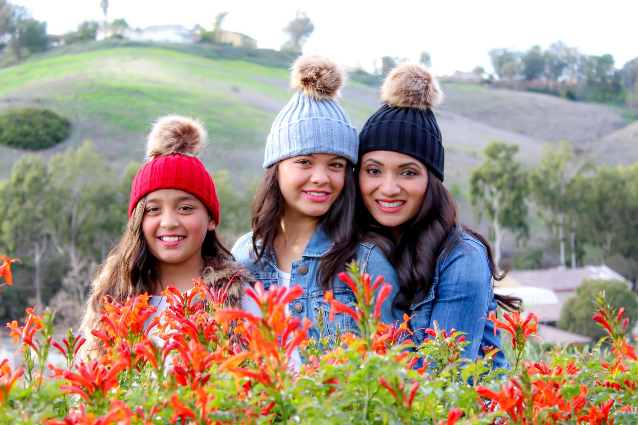 Lifestyle blogger Debbie Savage of To Thine Own Style Be True sharing her love for ILYMIX Fashion Accessories with her two daughters wearing Faux Fur Pom Pom Beanie