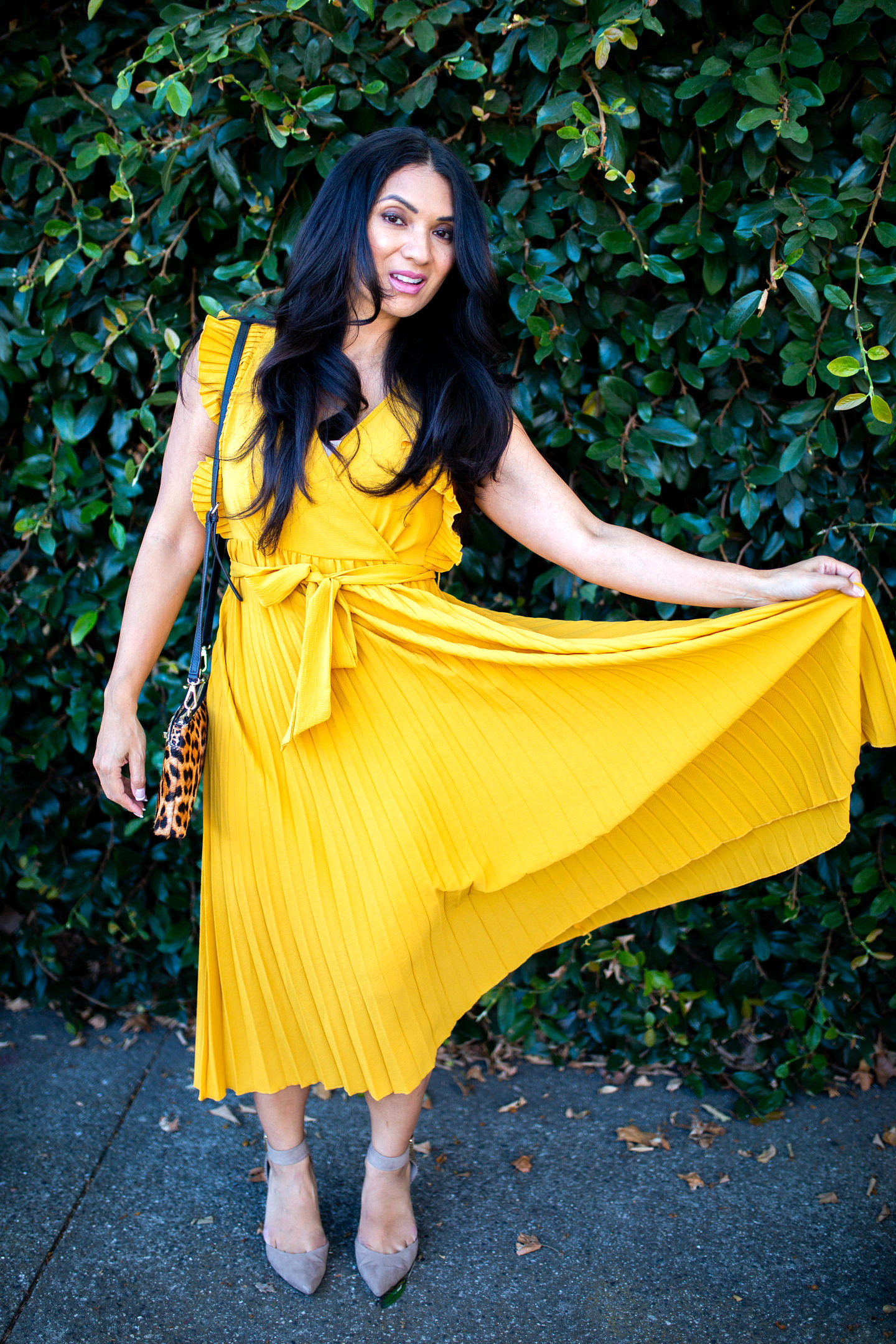 Curious how to incorporate a yellow pleated dress into your wardrobe? Orange County Blogger Debbie Savage is sharing her favorite way to style a yellow pleated dress here!