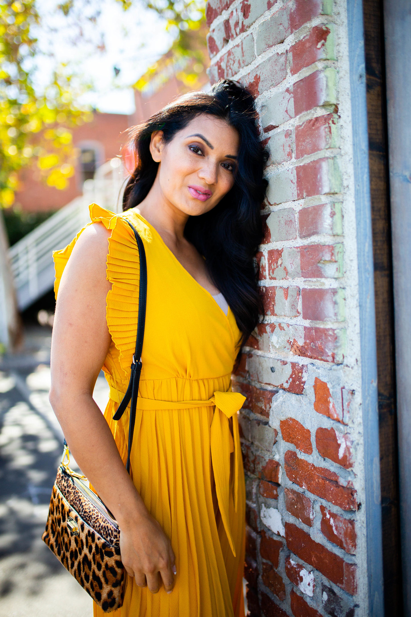 Bookmark this post ASAP if you have wanted to style a yellow pleated dress this holiday season! Keep reading as Orange County Blogger Debbie Savage share her favorite way to style a yellow pleated dress like a pro. 