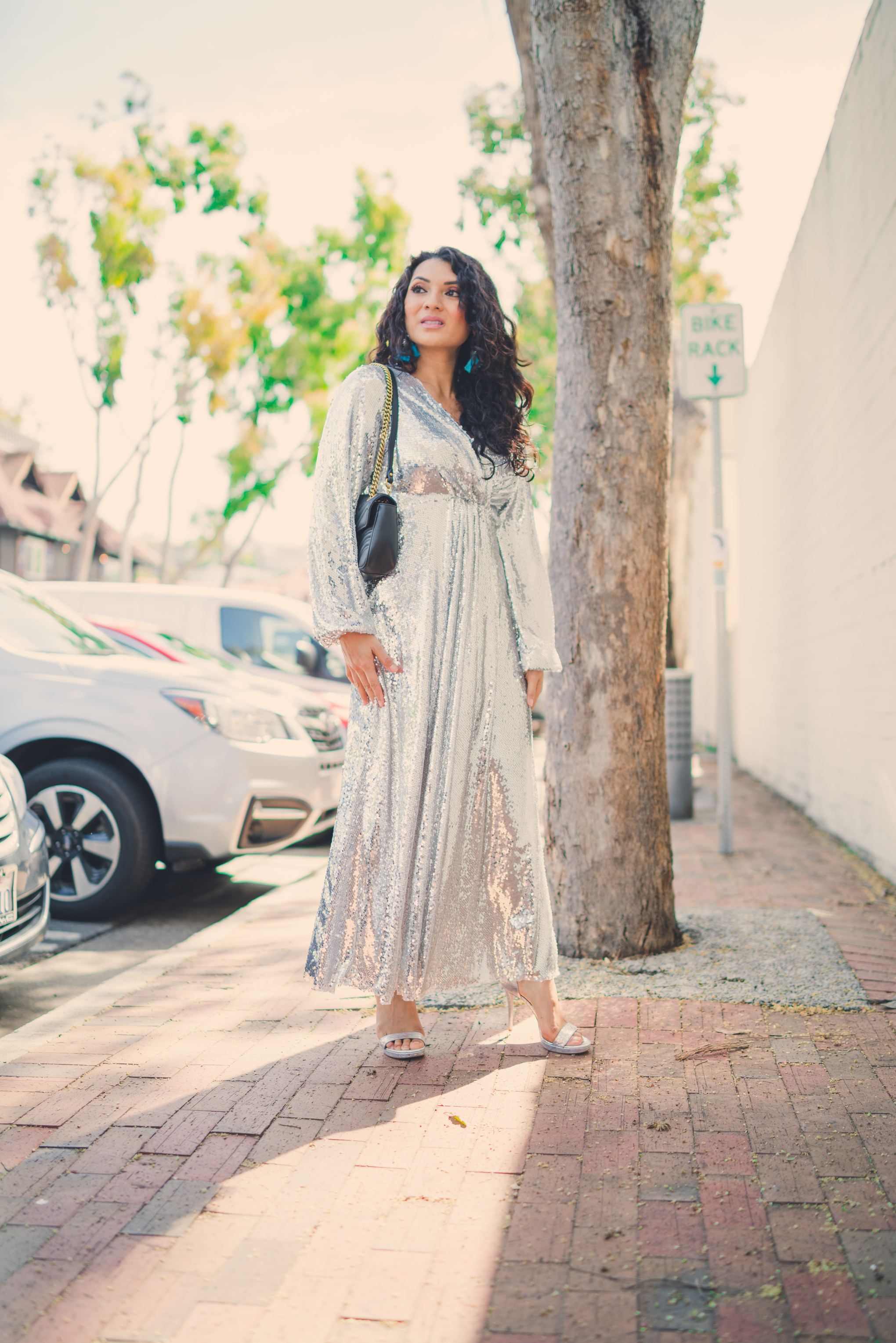 Bring on the glam with the perfect metallic sequin maxi dress! Curious how to style one? Orange County Blogger Debbie Savage is sharing how to style one. Click to see how HERE!